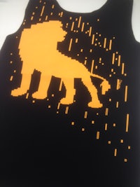 a pixelated image of a lion on a black background