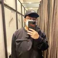 a man taking a selfie while wearing a face mask