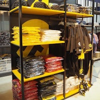 a display of t - shirts and hats in a store